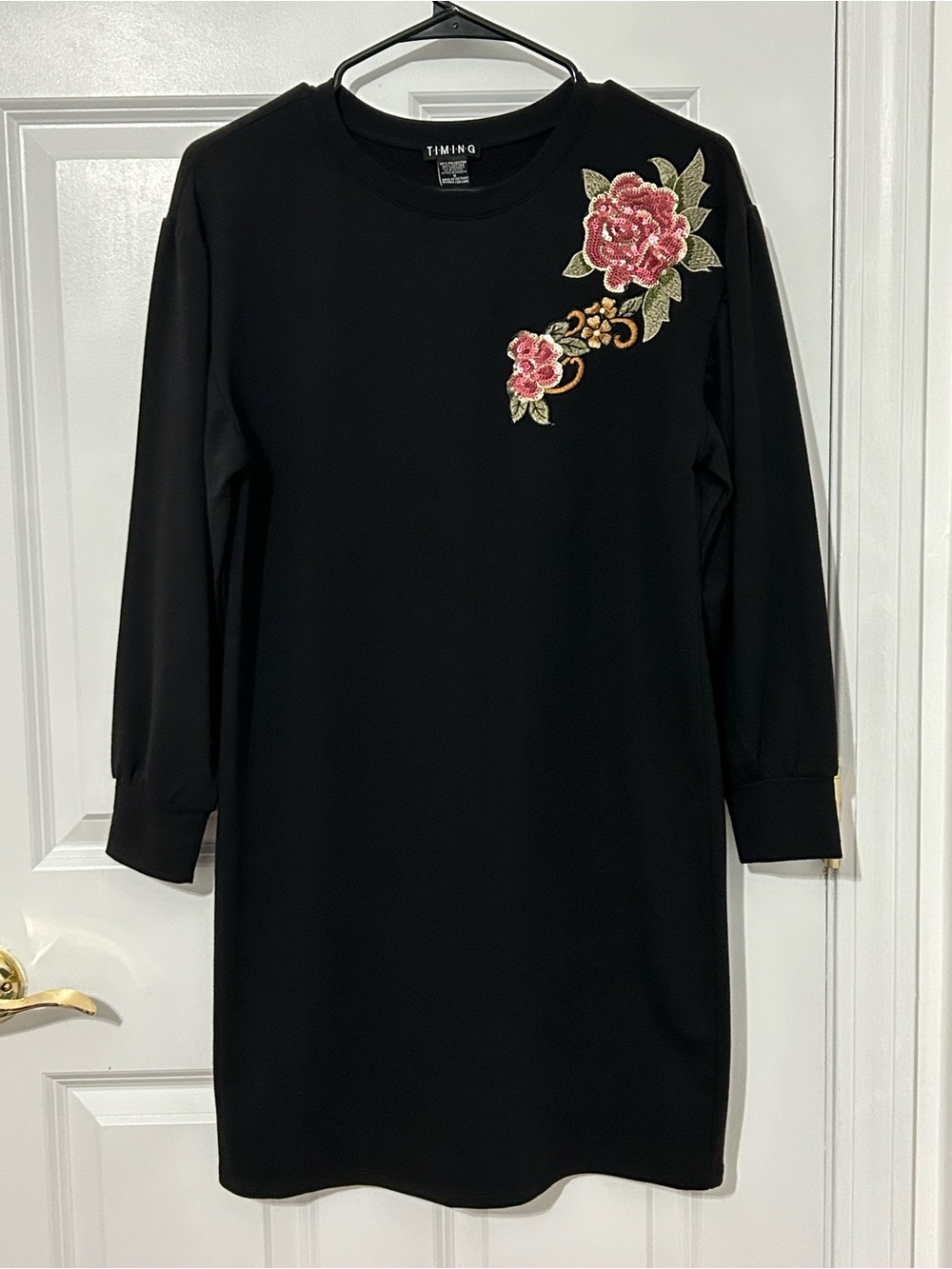 Black sweatshirt dress with floral motif